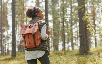 A Single Woman On A Hike Enjoys Her Freedom While Thinking About Her Future And Her Estate Planning Needs.