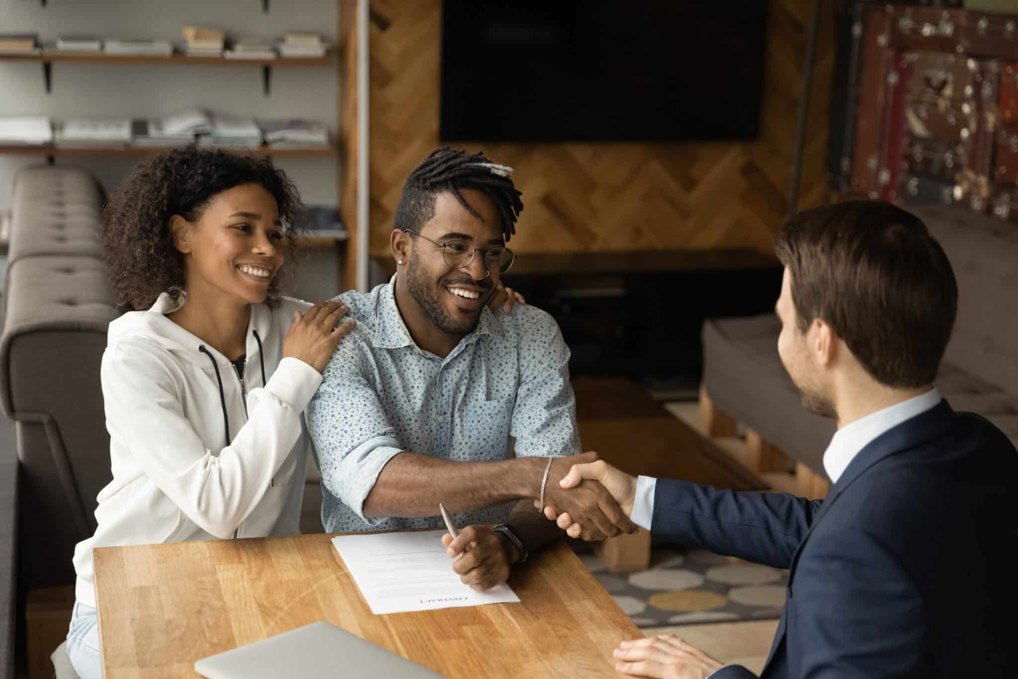 A young couple meeting with a lawyer about Estate Planning for young adults.