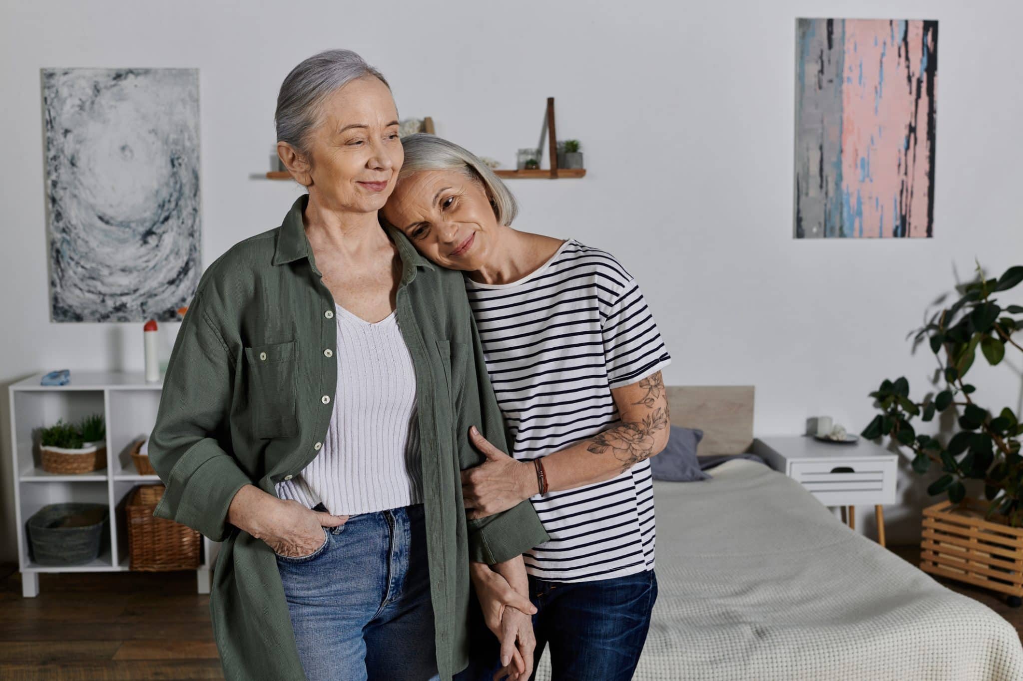 A couple embraces in their shared home representing domestic partnerships & estate planning.